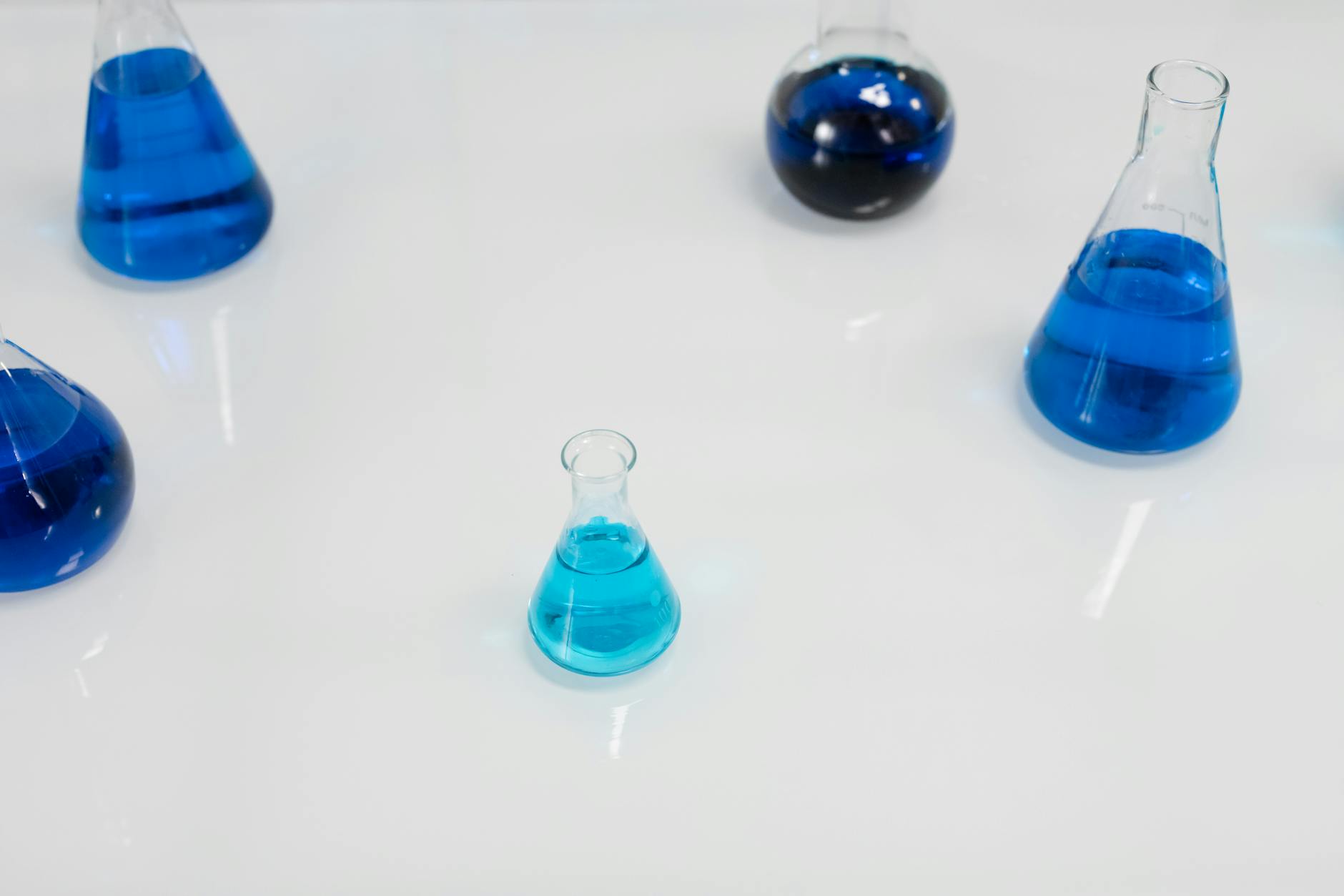 Blue liquid in laboratory flask — methylene blue mitochondrial energy research